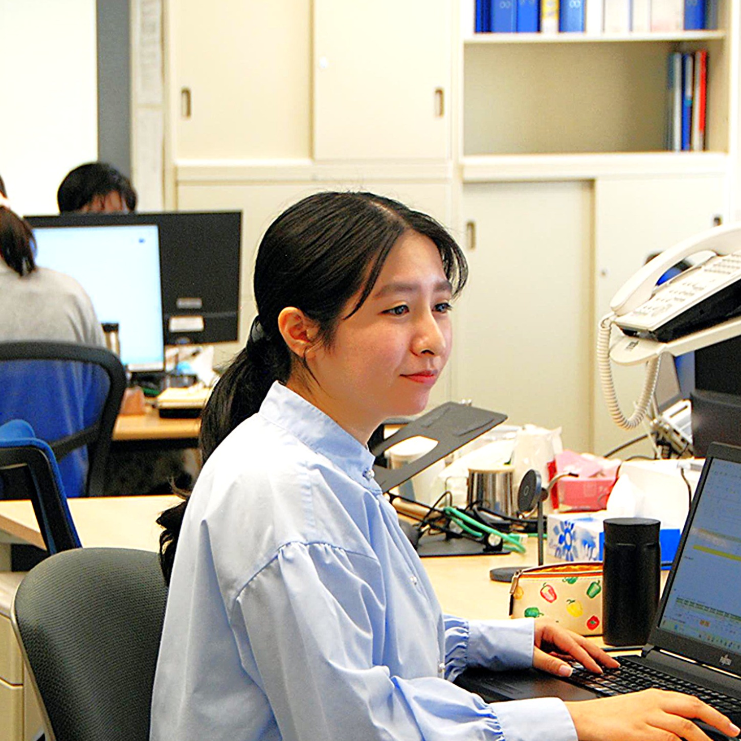 未経験からプロフェッショナルへ成長した社員の笑顔